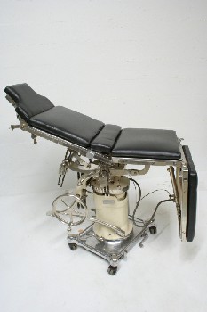 Chair, Medical, OPERATING, ADJUSTING LEVERS, WHITE CENTER COLUMN, BLACK PADDING, ROLLING, STAINLESS STEEL, SILVER