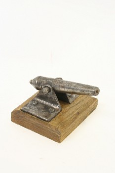 Decorative, Cannon, MINIATURE CANNON ON HINGE, WOOD BASE, METAL, BROWN