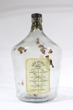 Decorative, Bottle, LEAVES RESIDUE,NEARLY EMPTY,WOOD CORK, PLANT LABEL, GLASS, CLEAR