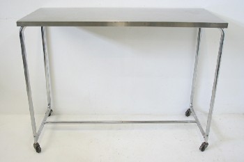 Table, Stainless Steel, ROUNDED TUBULAR CHROME FRAME W/CROSSBAR, ROLLING, SMALL WHEELS, STAINLESS STEEL, SILVER