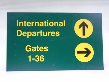 Sign, Airport, INTERNATIONAL DEPARTURES, GREEN BACKGROUND, YELLOW TEXT, BLACK ARROWS IN YELLOW CIRCLES , PLASTIC, GREEN